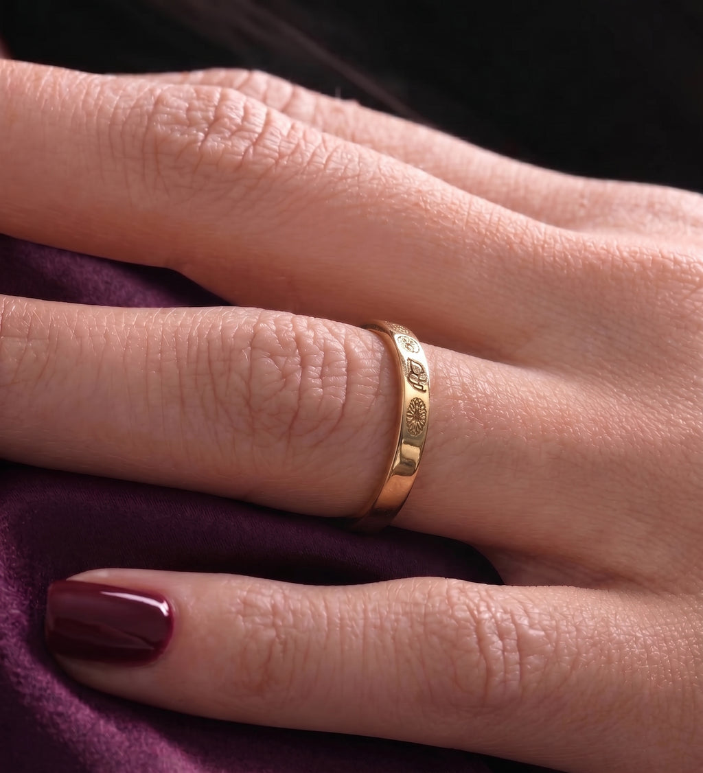Close-up of the birth flower ring worn on the finger