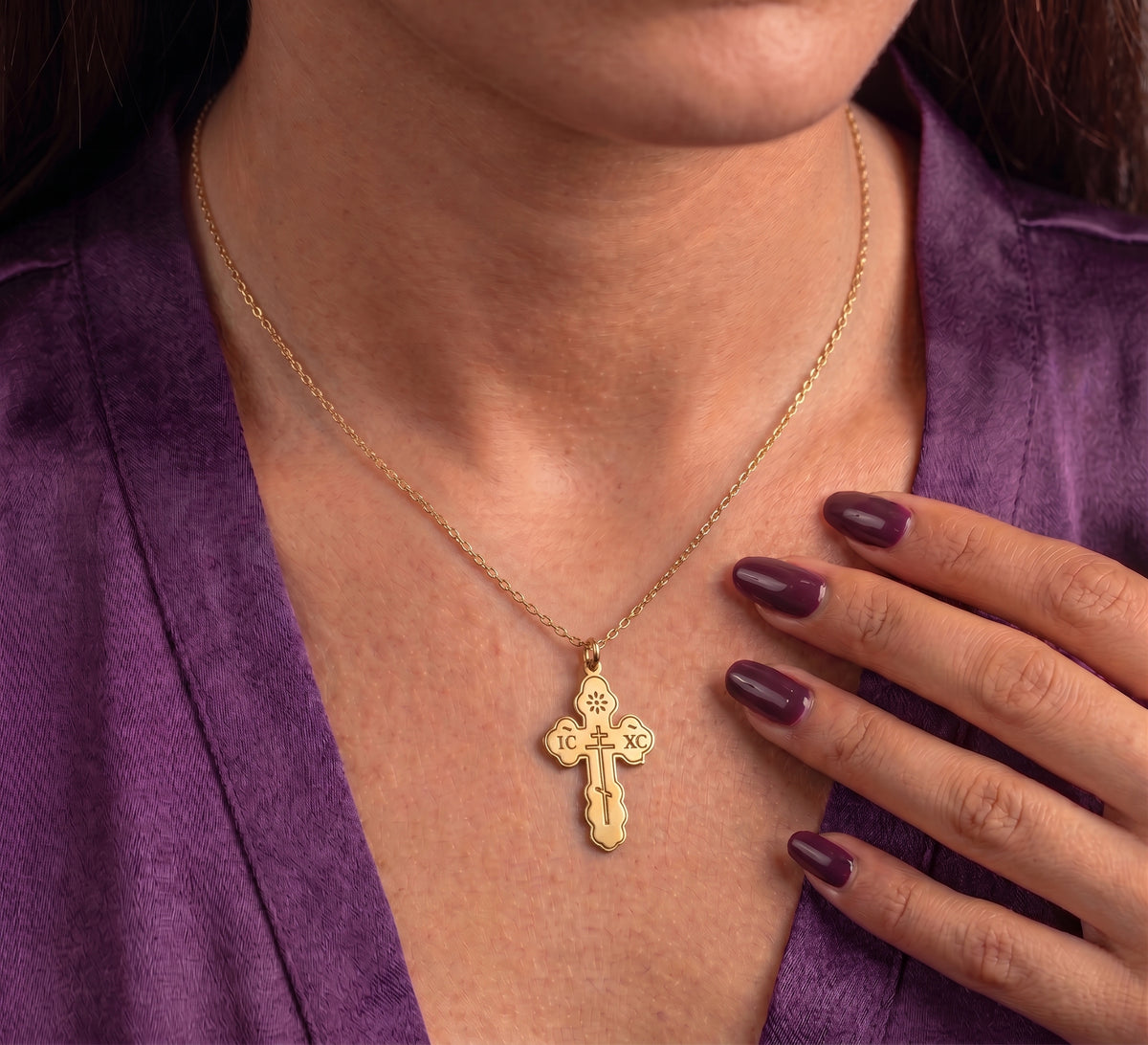 Cross necklace worn on the chest