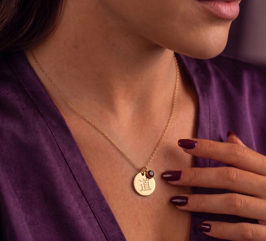 Kanji disc necklace worn on the chest