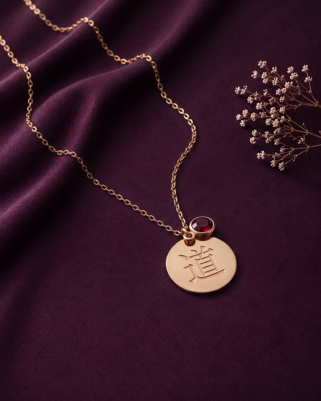 Kanji disc necklace with a red stone and dried flowers