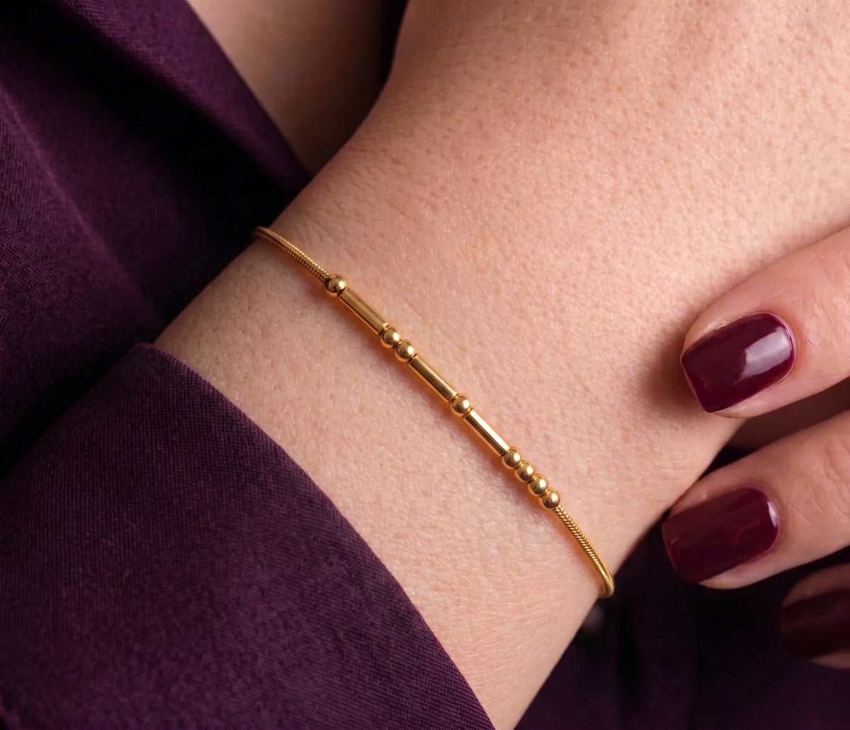 Morse code bracelet worn on the wrist, close-up