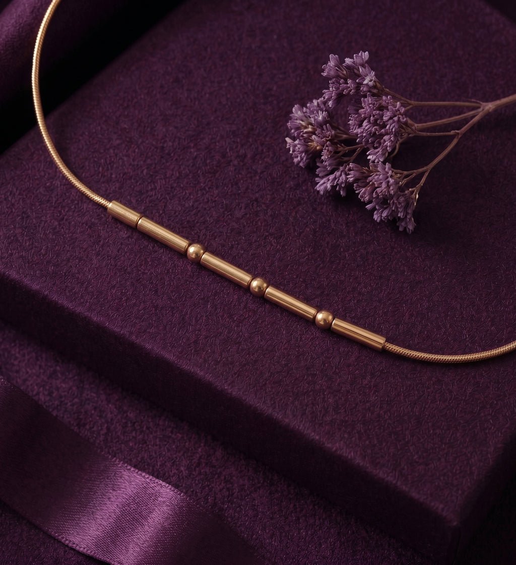 Close-up of the beads and bars of the Morse code bracelet on velvet
