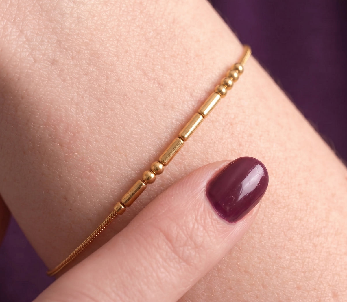 Detail of the Morse code bracelet worn on the wrist