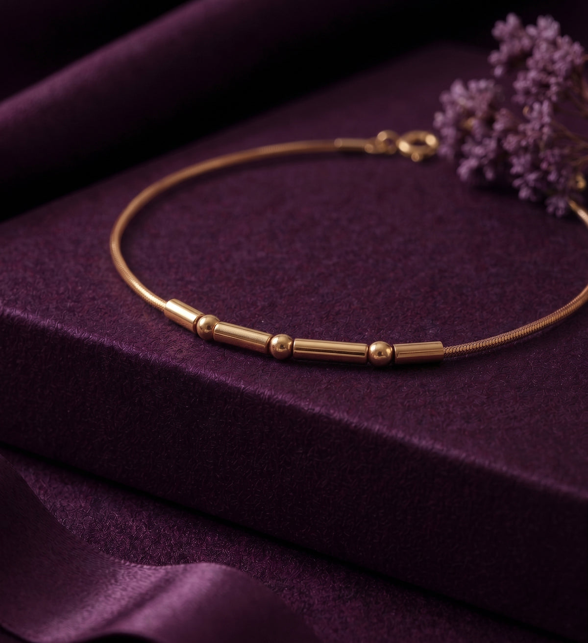 Morse code bracelet on a plum box, showing the clasp