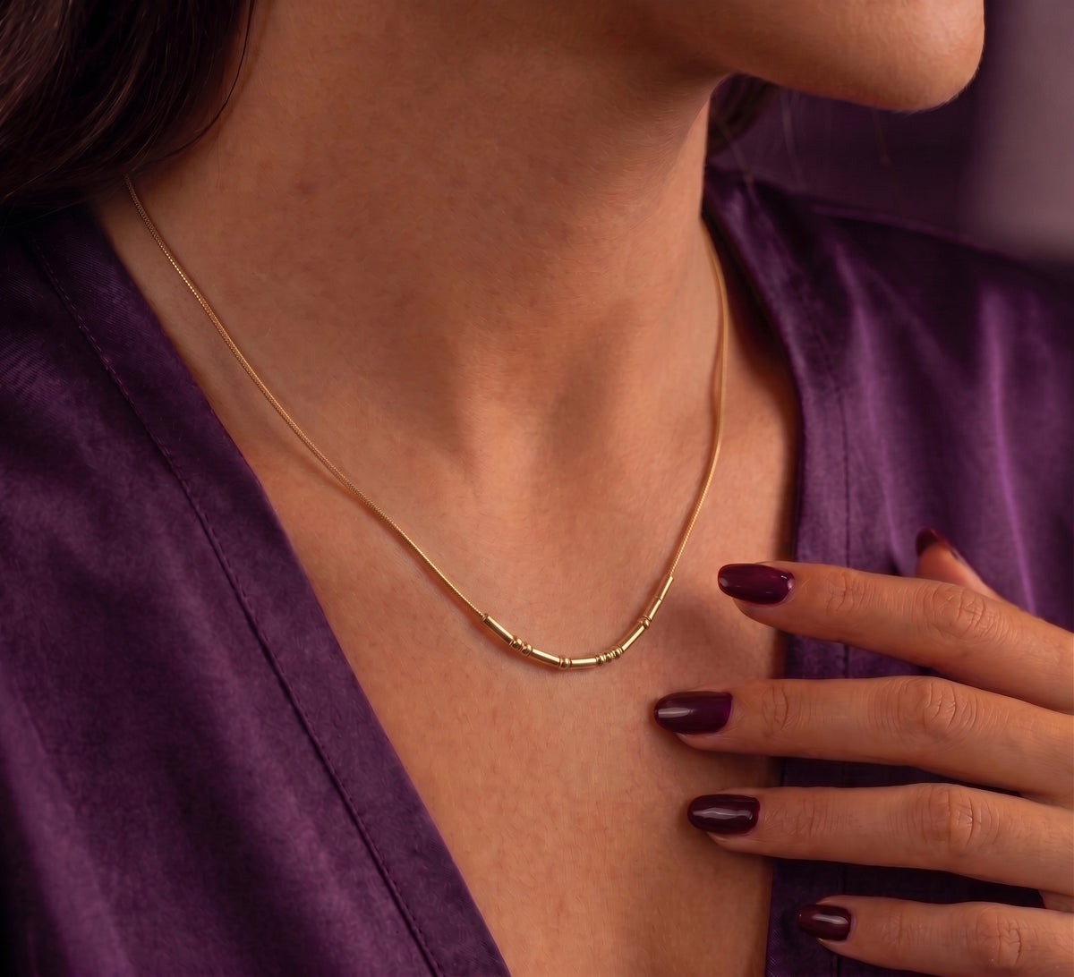 Morse code necklace worn at the collarbone