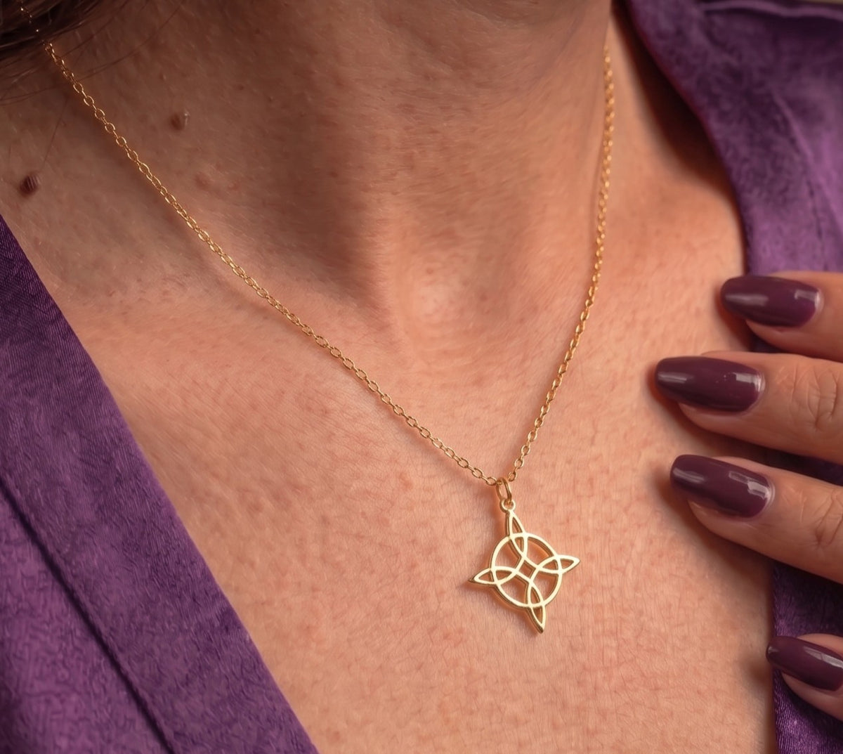 Close-up of the witch's knot pendant worn
